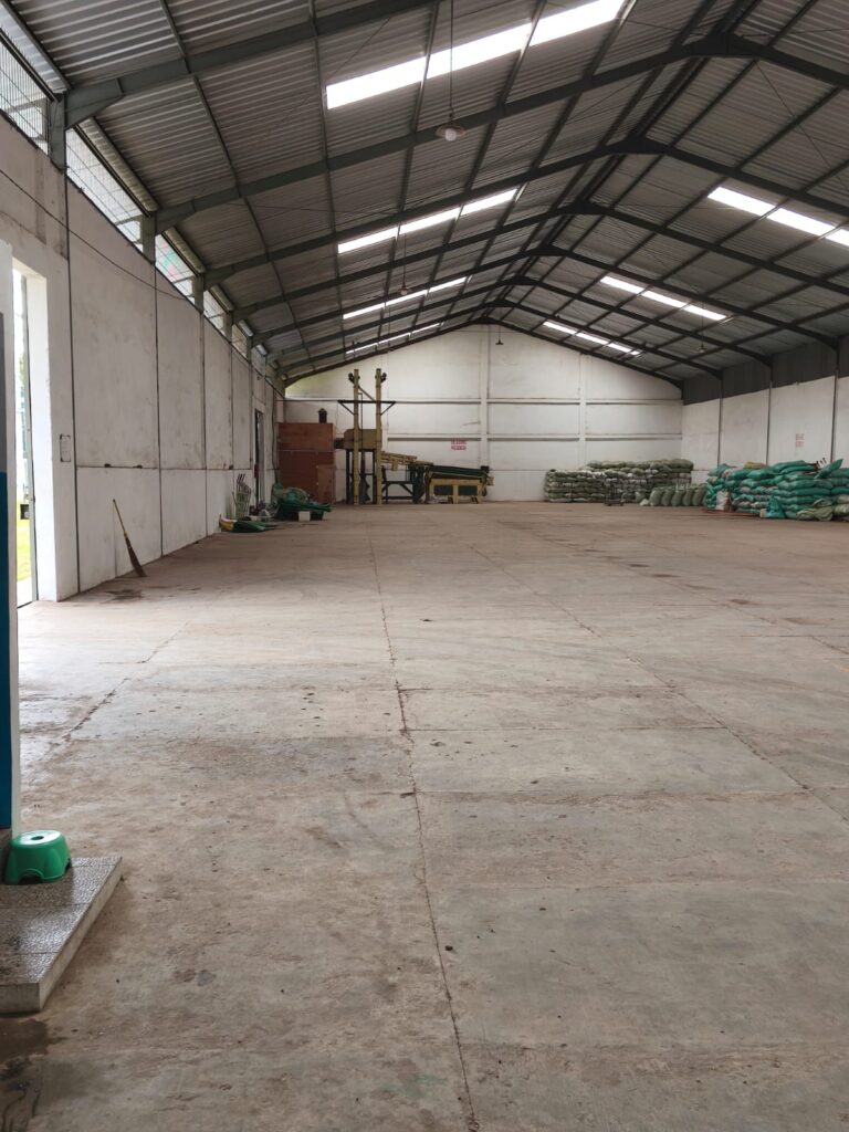 The spacious warehousing and processing facility of Swarna Agro, a leading Indonesia coffee company, demonstrating the large-scale capacity for storing and handling bulk wholesale orders of green coffee beans for international export.